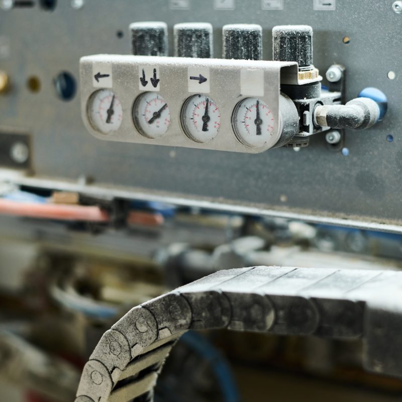 Close-up of indicators showing the pressure on machine equipment at factory